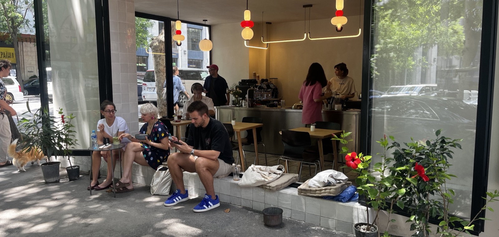 The interior of No More Mondays, a coffee shop, with its counter and seating.